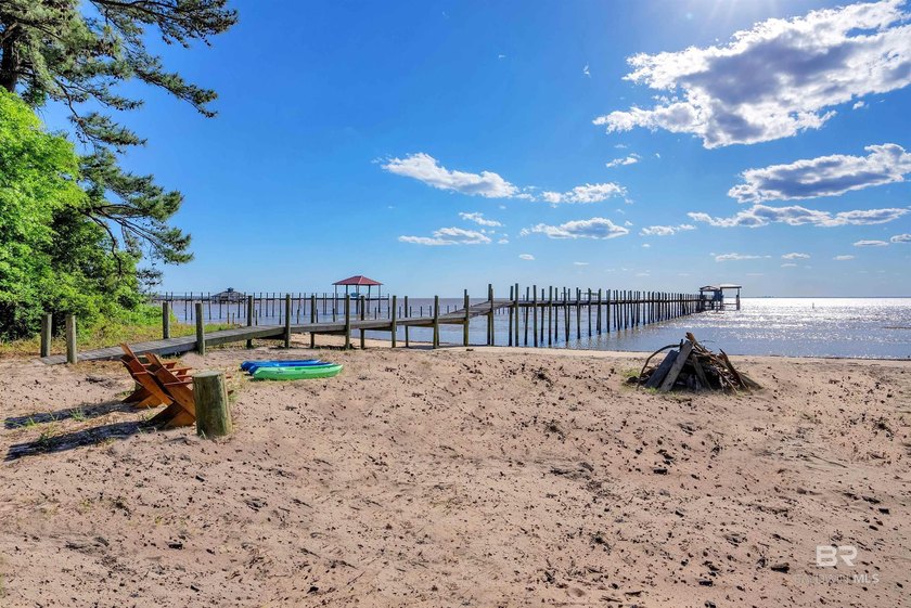 This exquisite bayfront residence features 1.22 acres along the - photo 17