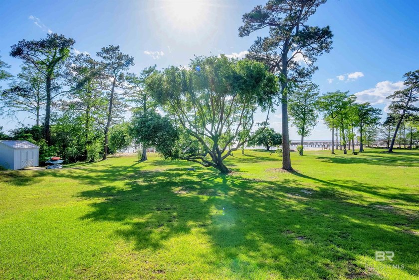 This exquisite bayfront residence features 1.22 acres along the - photo 29