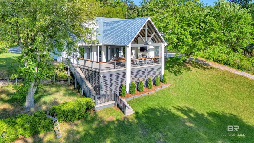 This exquisite bayfront residence features 1.22 acres along the - photo 32