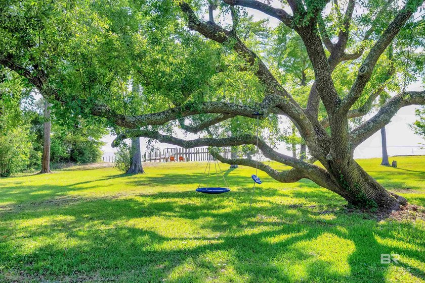 This exquisite bayfront residence features 1.22 acres along the - photo 33