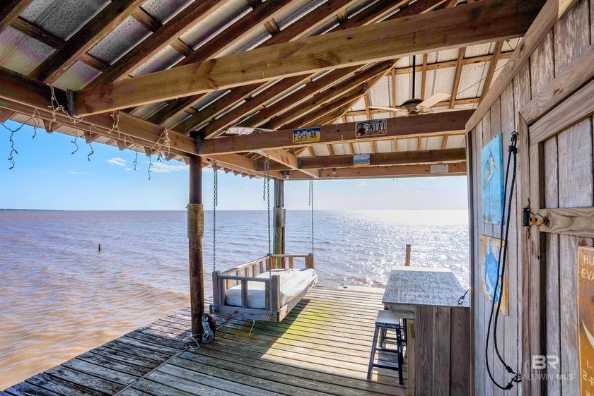 This exquisite bayfront residence features 1.22 acres along the - photo 34