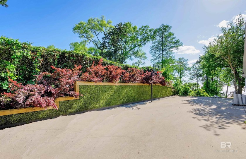 This exquisite bayfront residence features 1.22 acres along the - photo 38