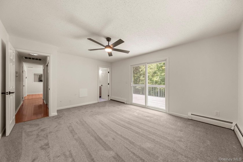 Tucked away on a beautifully wooded and private lot, this - photo 17