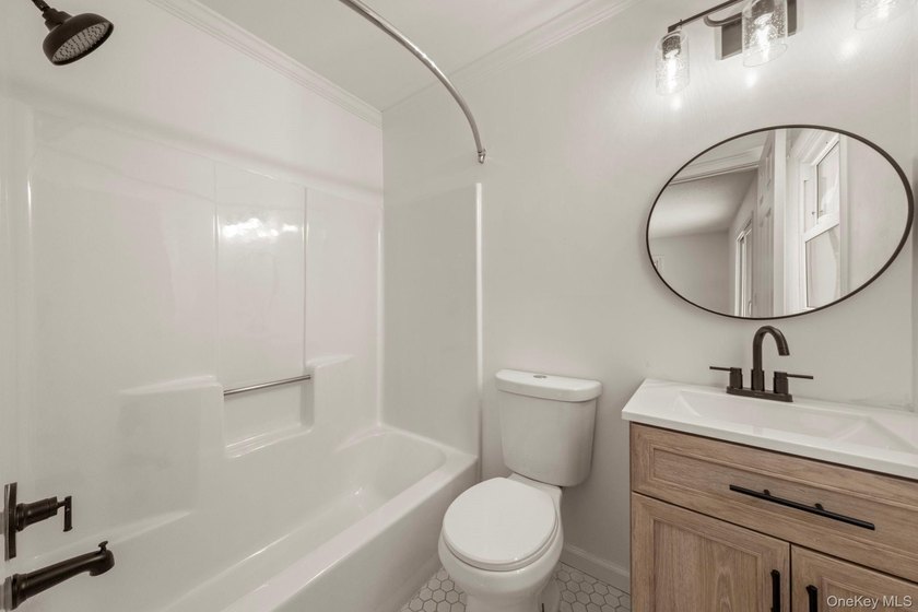 Tucked away on a beautifully wooded and private lot, this - photo 19