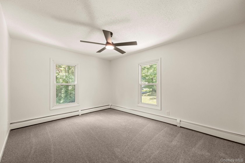 Tucked away on a beautifully wooded and private lot, this - photo 20