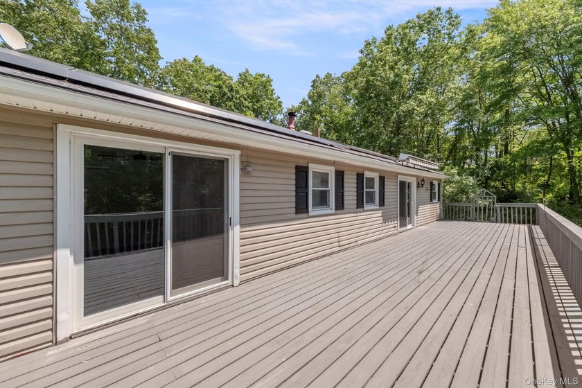 Tucked away on a beautifully wooded and private lot, this - photo 35