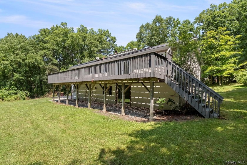 Tucked away on a beautifully wooded and private lot, this - photo 38