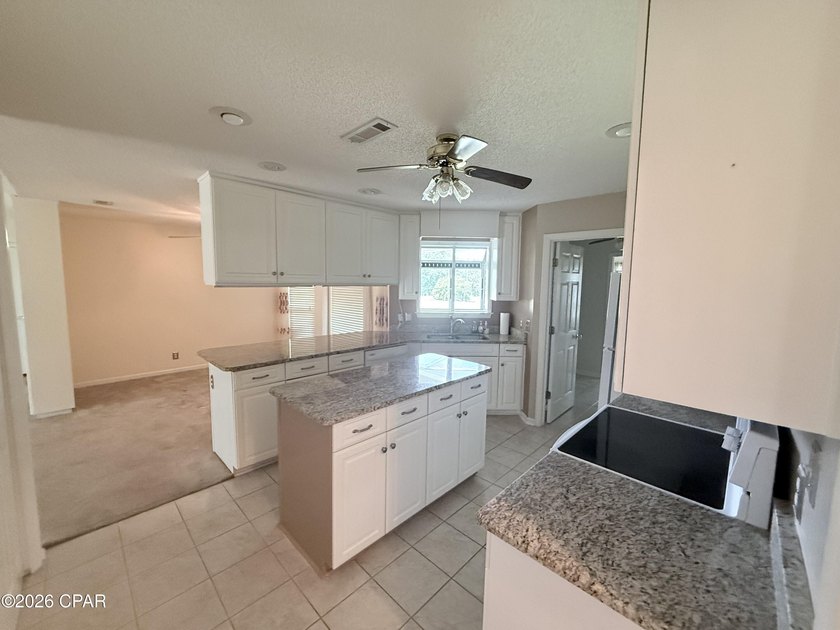 Welcome home to this spacious 3-bedroom, 2-bath brick home - photo 8