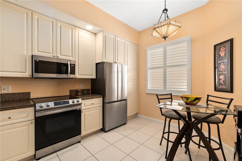 Live the high life in this elegant top-floor condo with soaring - photo 8