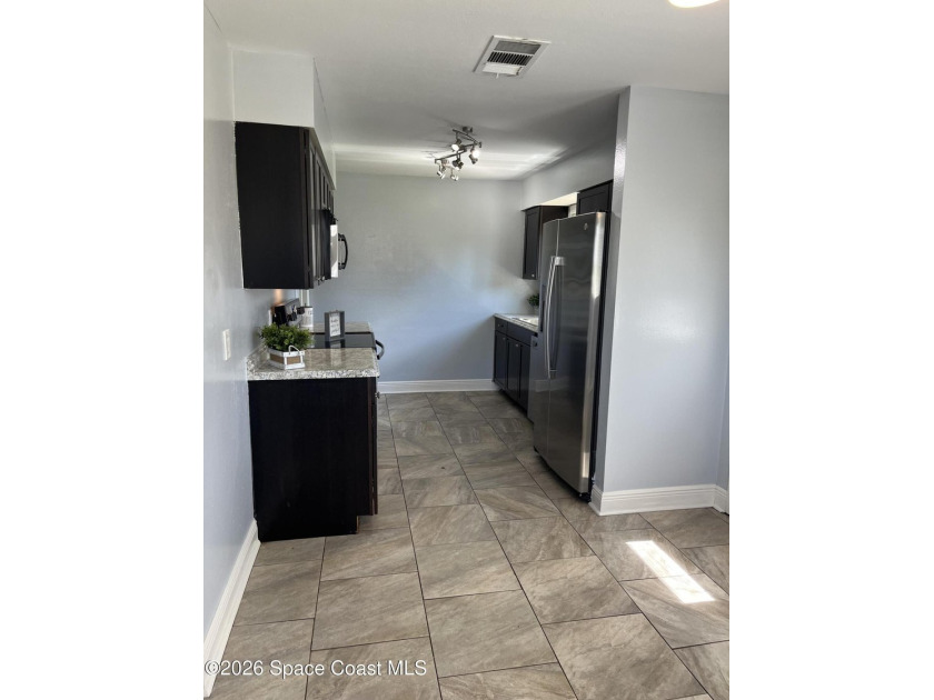 TRI LEVEL HOME on .26 of an acre! 3 Bedroom 2 bath with Living - photo 22