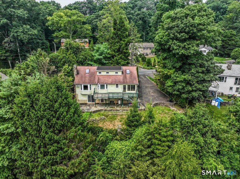 Welcome to this charming stone-front, 4-bedroom, 3-full-bath New - photo 6