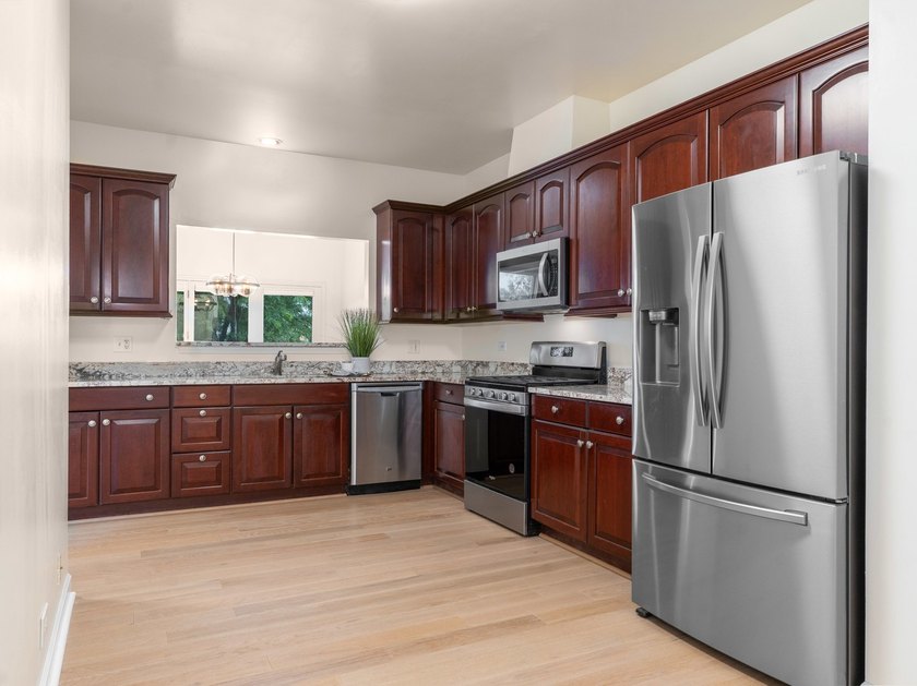Thoughtfully refreshed and move-in ready. Since its previous - photo 7