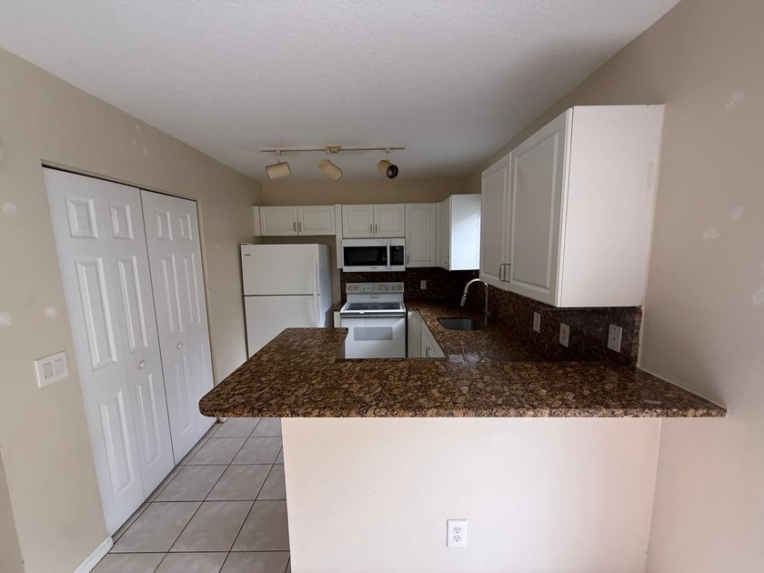 Welcome to this exceptional condominium located in the Cove at - photo 12