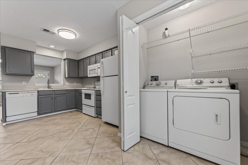 Freshly painted 2-bedroom, 2-bath townhome-style condo in a - photo 12