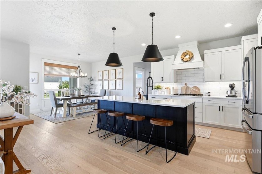 Experience this custom-built 3-bedroom, 2.5-bath home with a - photo 3