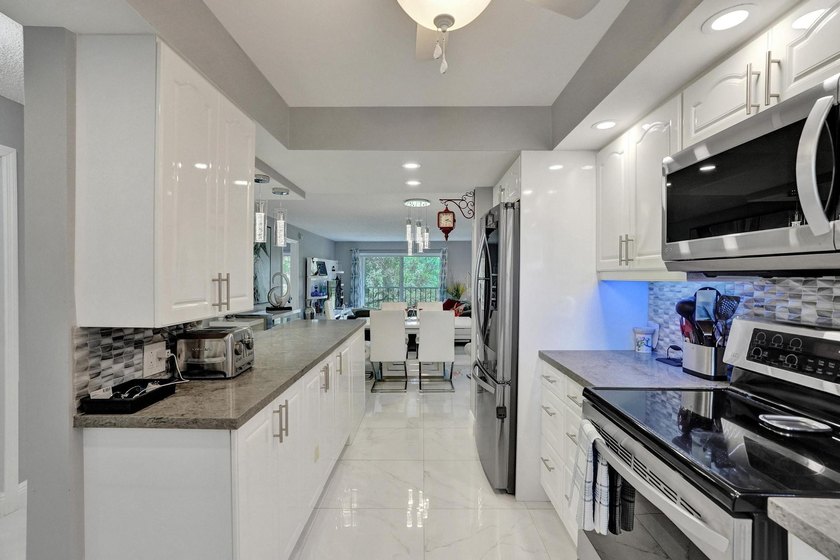 Experience effortless South Florida living in this fully - photo 11
