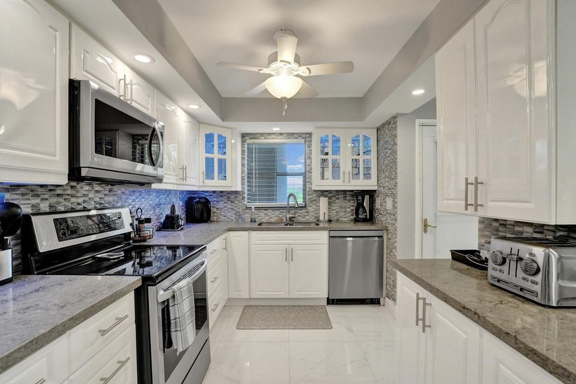 Experience effortless South Florida living in this fully - photo 12