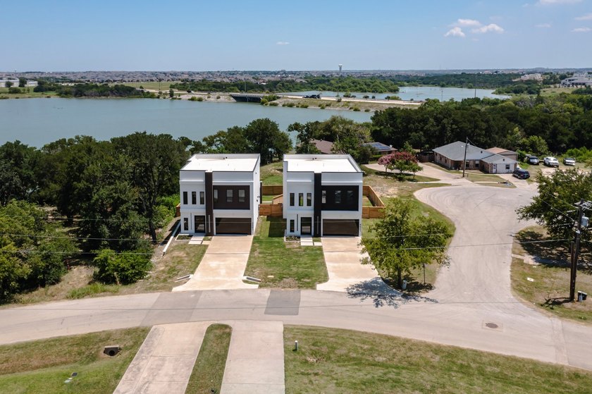 Experience modern waterfront luxury in this stunning - photo 18