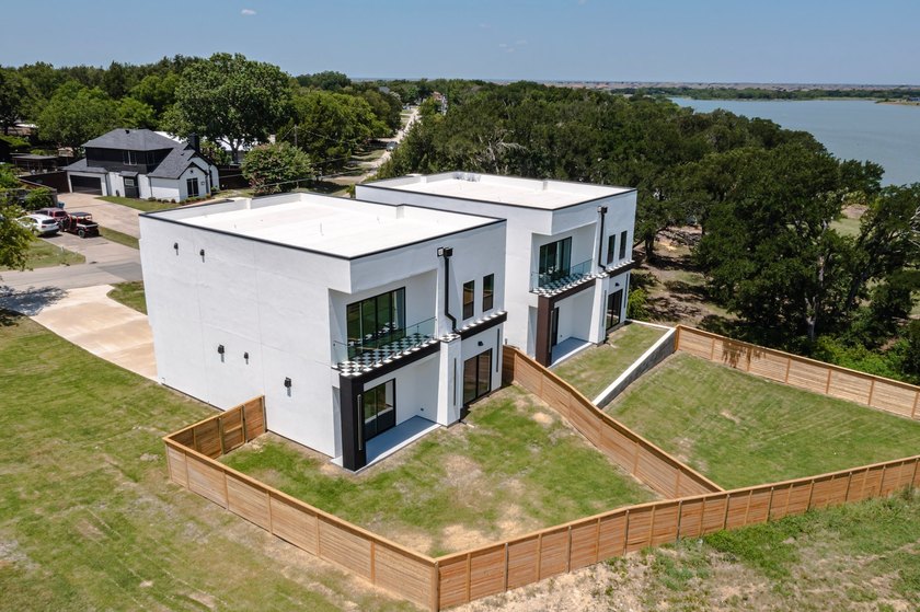 Experience modern waterfront luxury in this stunning - photo 29