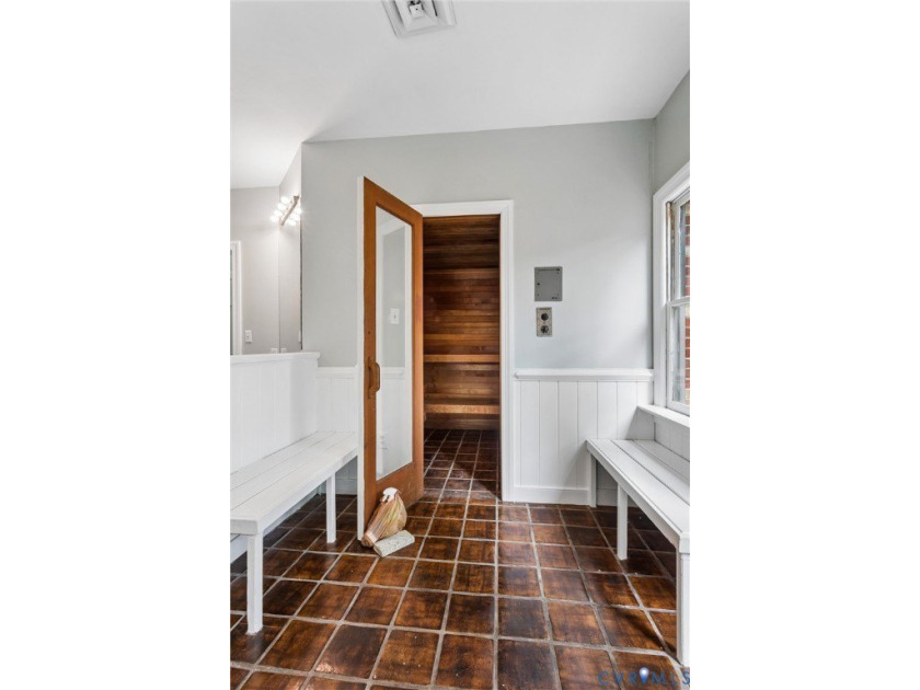 Hidden among mature trees on a rare double lot, this exceptional - photo 30