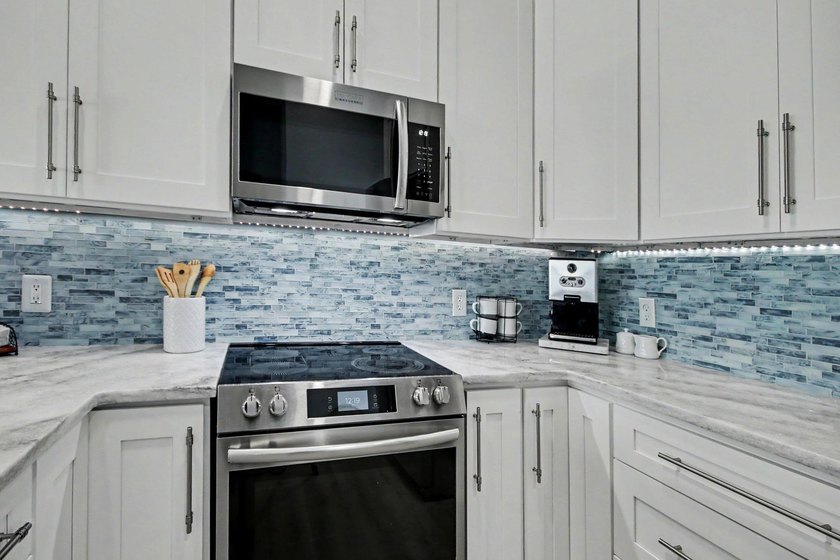 Experience coastal living in a beautifully updated home located - photo 12