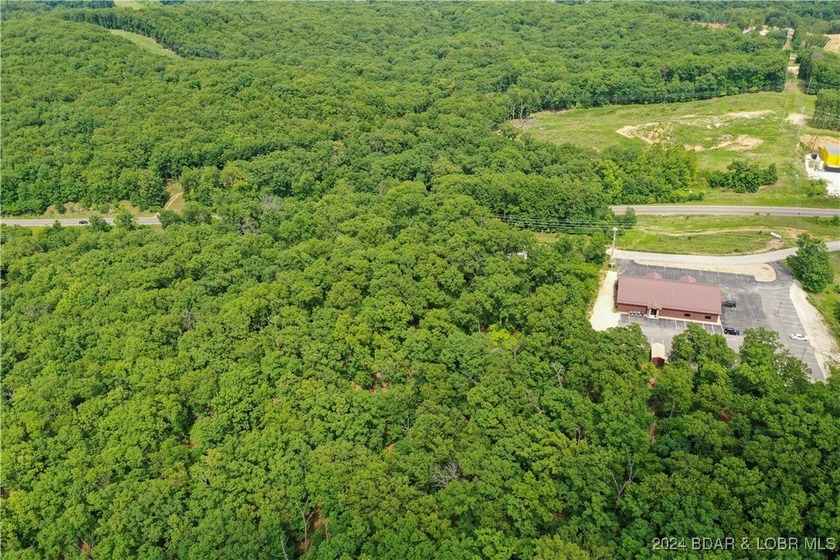 This expansive 5-acre commercial lot boasts exceptional frontage - photo 18
