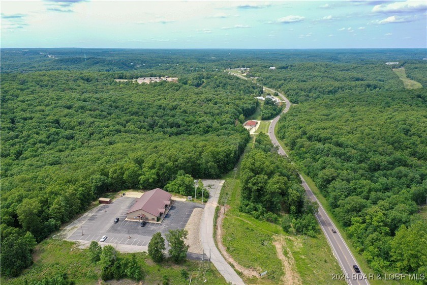 This expansive 5-acre commercial lot boasts exceptional frontage - photo 24