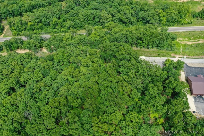 This expansive 5-acre commercial lot boasts exceptional frontage - photo 27