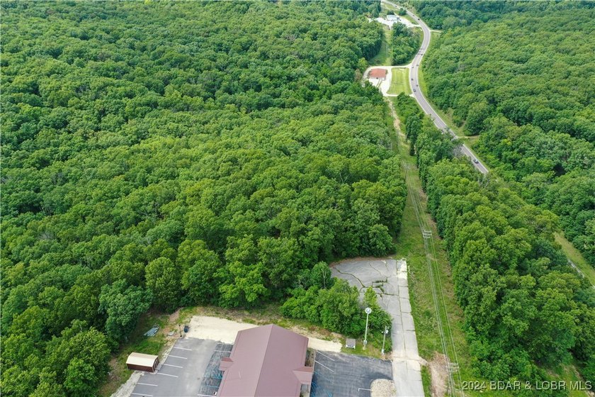 This expansive 5-acre commercial lot boasts exceptional frontage - photo 32