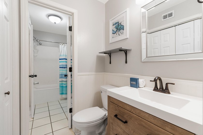 Enjoy coastal charm in this beautifully decorated 1 bed, 1.5 - photo 15