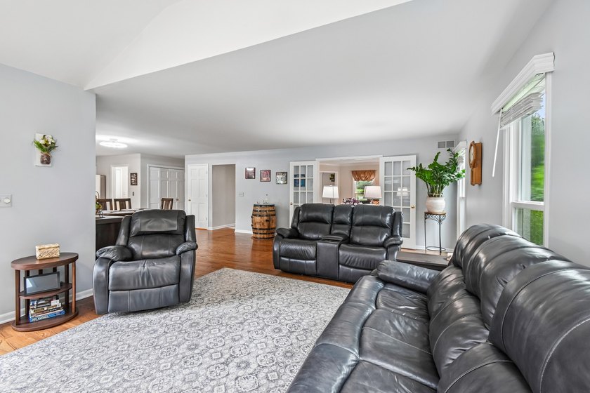 Nestled on a picturesque 1.25-acre tree-lined lot at the end of - photo 9