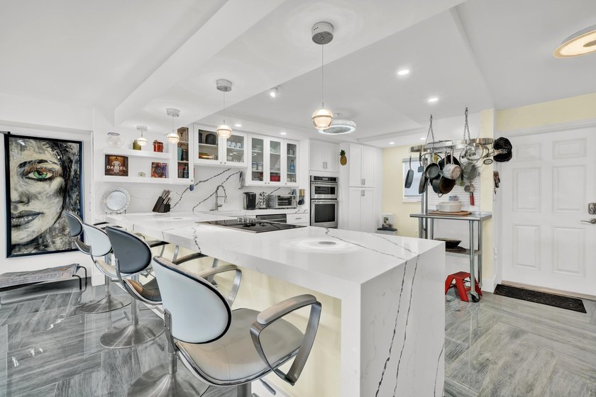 One of the finest three-bedroom waterfront residences in - photo 7