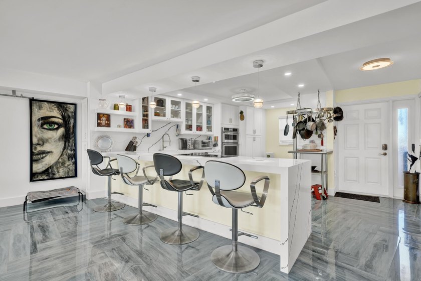 One of the finest three-bedroom waterfront residences in - photo 9