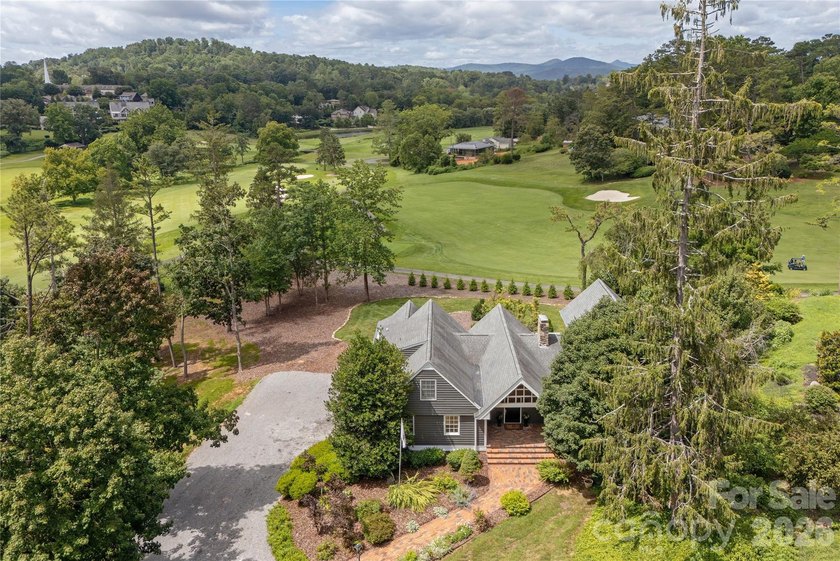 Set on a private .7-acre lot in North Asheville, this 3-bedroom - photo 3