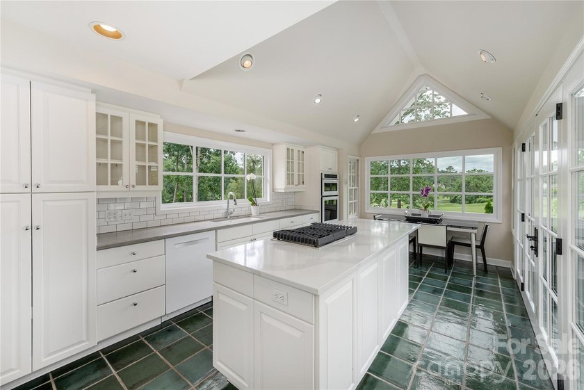 Set on a private .7-acre lot in North Asheville, this 3-bedroom - photo 8