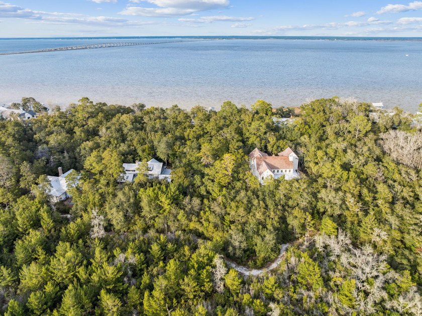 This exceptional 0.33-acre homesite offers bay views within the - photo 3