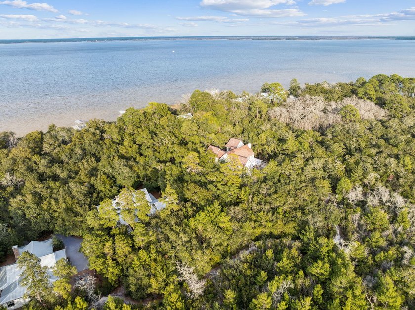 This exceptional 0.33-acre homesite offers bay views within the - photo 4