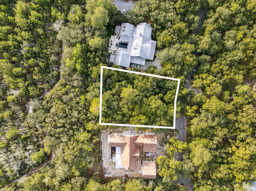 This exceptional 0.33-acre homesite offers bay views within the - photo 6