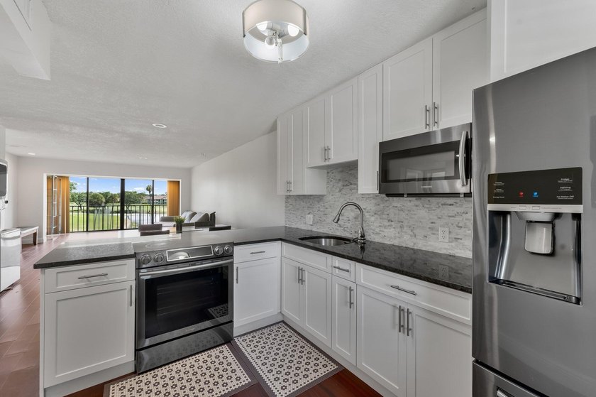 Wake up to tranquil lake and golf course views in this - photo 5