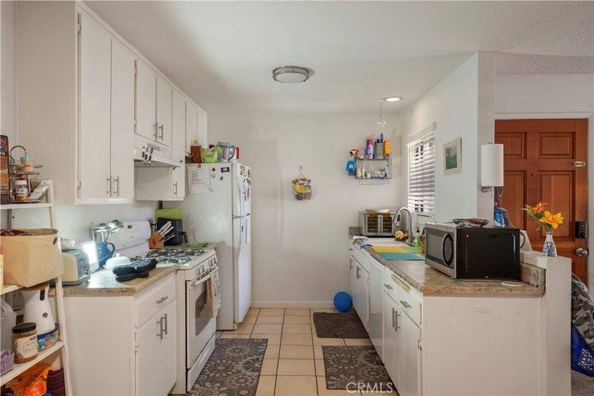 Welcome to 3420 Santa Maria Way, Unit 102C! This ground-floor - photo 4