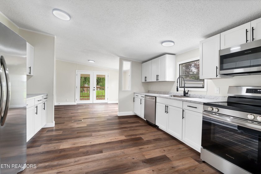 Completely remodeled inside and out, this move-in ready home on - photo 11