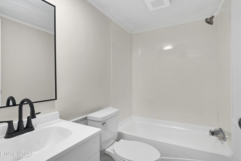 Completely remodeled inside and out, this move-in ready home on - photo 32