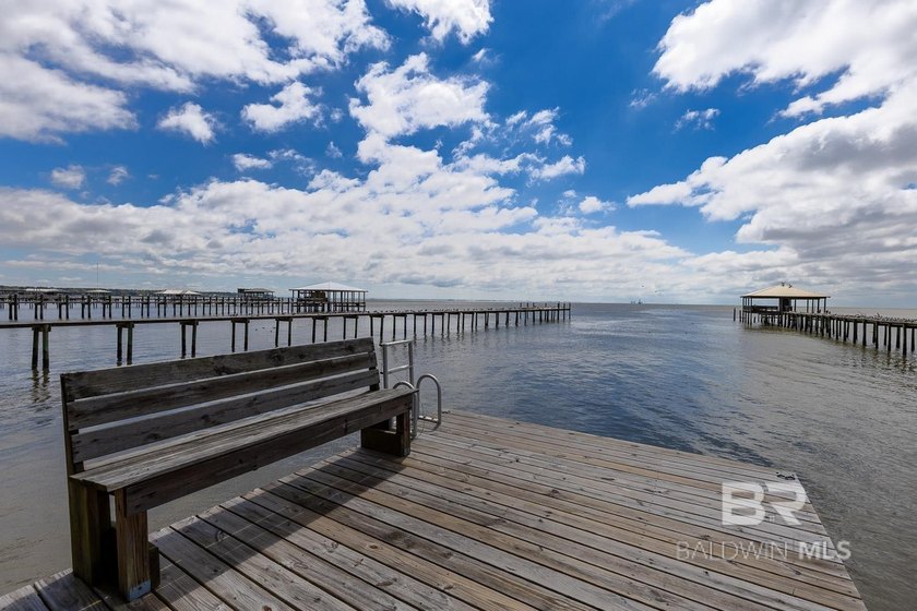 ENJOY BEAUTIFUL SUNSETS AND BAYFRONT LIVING EVERYDAY. This - photo 5