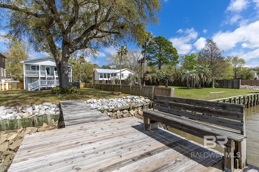 ENJOY BEAUTIFUL SUNSETS AND BAYFRONT LIVING EVERYDAY. This - photo 6