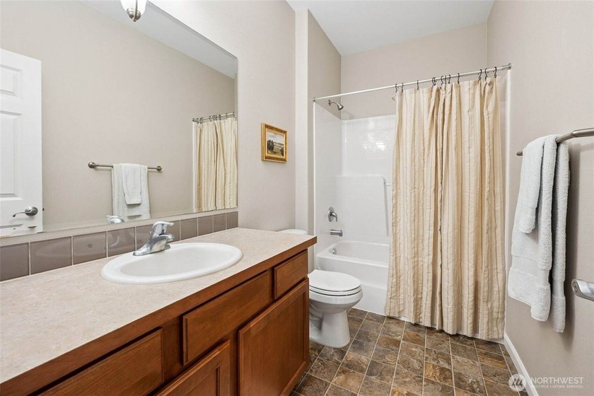 Welcome home to Evergreen Heights! Meticulously maintained and - photo 6