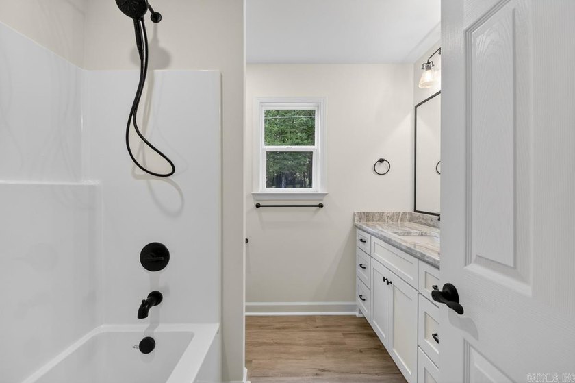 WOW! New Construction! Very pretty white siding w/white brick! - photo 13