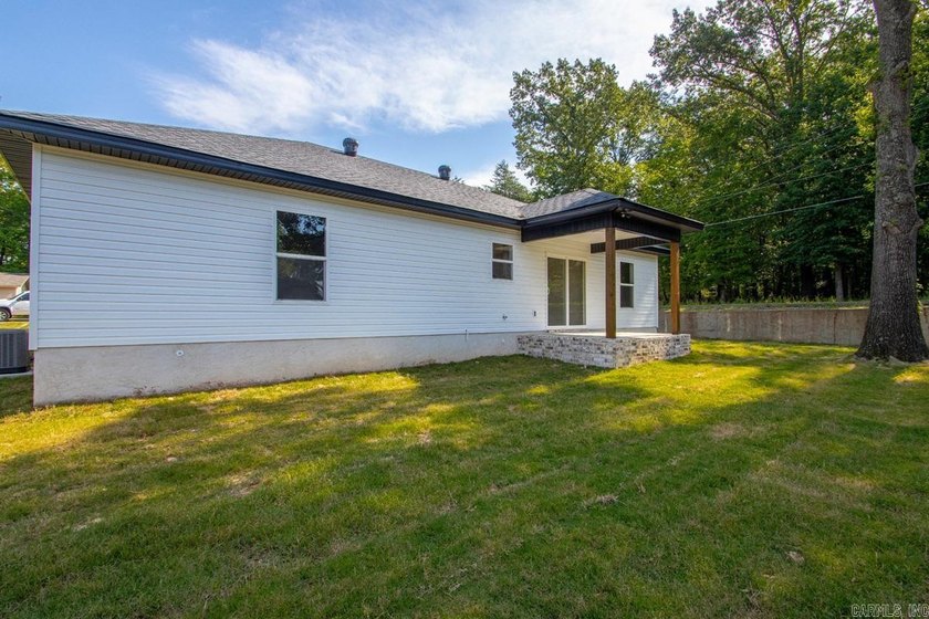 WOW! New Construction! Very pretty white siding w/white brick! - photo 28
