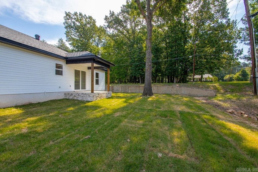 WOW! New Construction! Very pretty white siding w/white brick! - photo 29