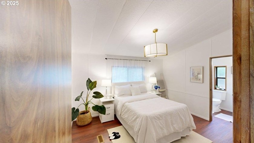 Tucked into a peaceful, wooded setting, this restored 2-bedroom - photo 11