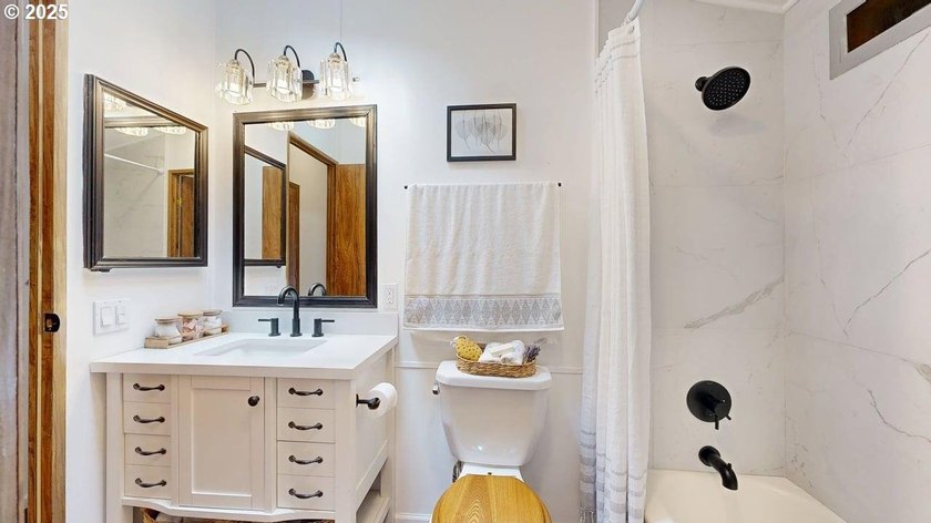 Tucked into a peaceful, wooded setting, this restored 2-bedroom - photo 18
